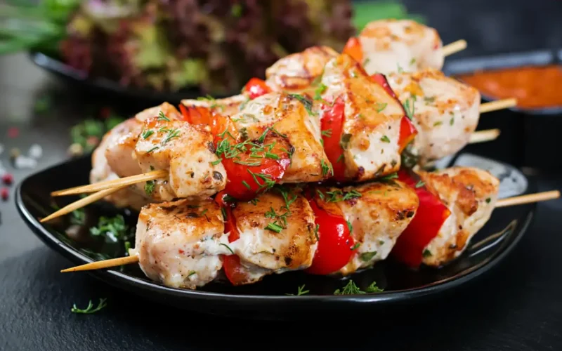 A variety of Persian dishes including saffron rice, kebabs, and hearty stews.