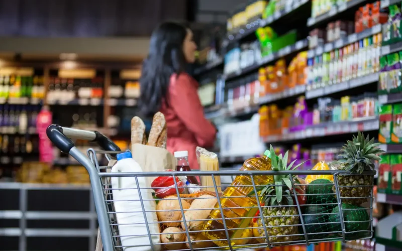 International aisle at Compare Foods Supermarket with Persian rice, bread, and snacks.